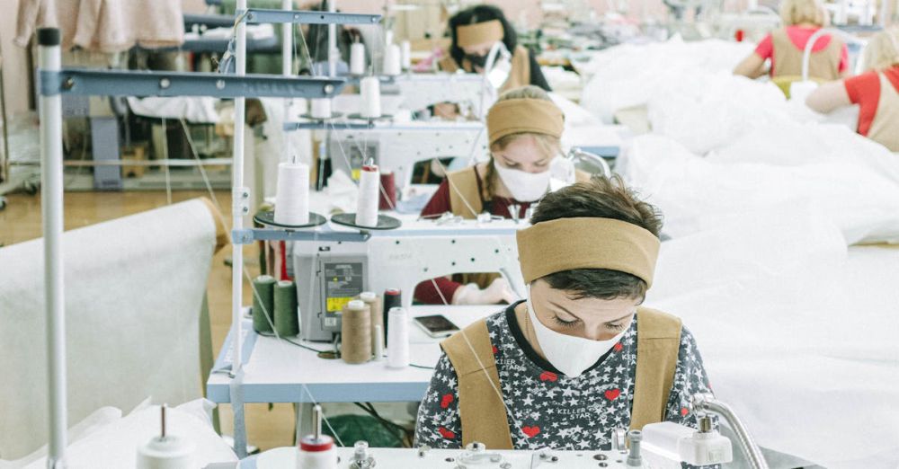 Headbands - Women working with sewing machines in a textile factory, focused on production.