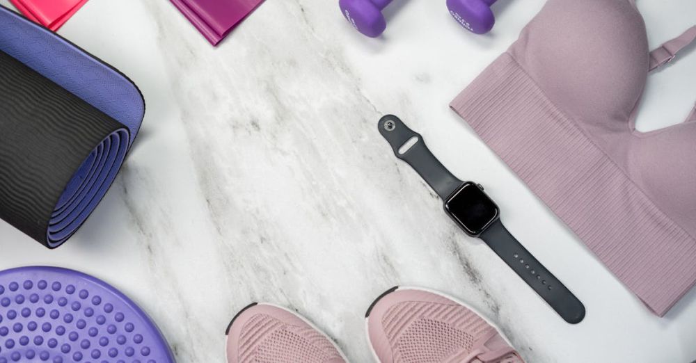 Resistance Bands - Flat lay of fitness gear including yoga mat, dumbbells, and smartwatch on a marble surface.