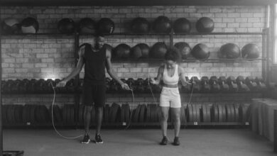 Jump Ropes - A fit couple working out in the gym with jump ropes, promoting a healthy lifestyle.