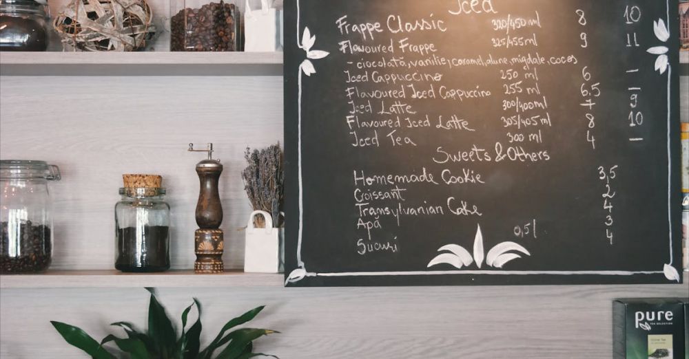 Spice Rack - Cozy café interior with tea menu on chalkboard, cups and plants on wooden shelves.