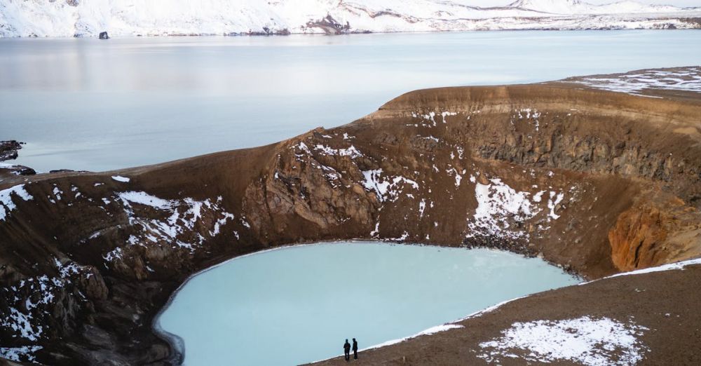 Immersion Blenders - Stunning aerial shot of Lake Viti surrounded by snowy mountains in Iceland. Ideal for travel and adventure themes.