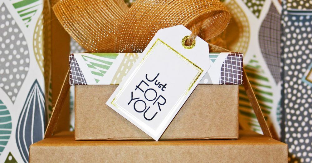 Gifts - A neatly wrapped gift box with decorative ribbon and 'Just For You' tag, perfect for celebrations.