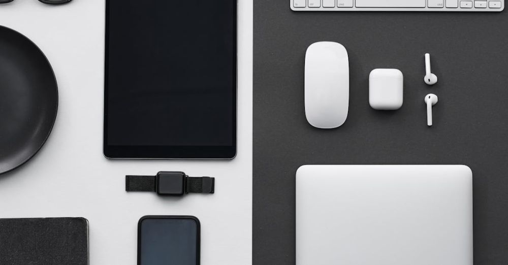 Gadgets - Stylish flatlay of modern tech gadgets including tablet, smartphone, smartwatch, and accessories.