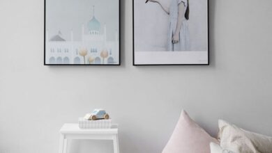 Decor - Minimalist Scandinavian bedroom with wall art and cozy decor elements.