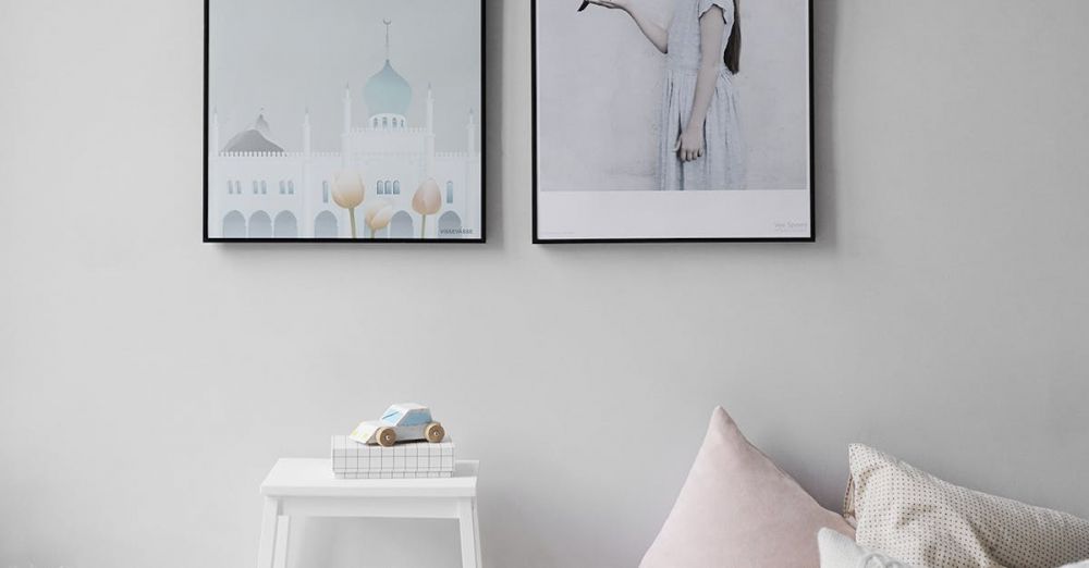 Decor - Minimalist Scandinavian bedroom with wall art and cozy decor elements.