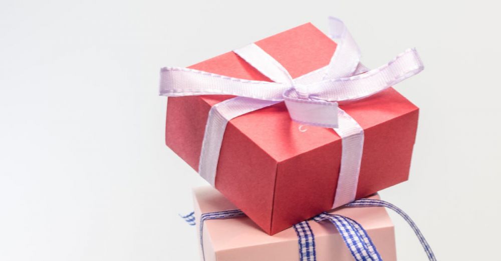 Gifts - A stack of colorful gift boxes tied with ribbons, perfect for celebrations and festive occasions.