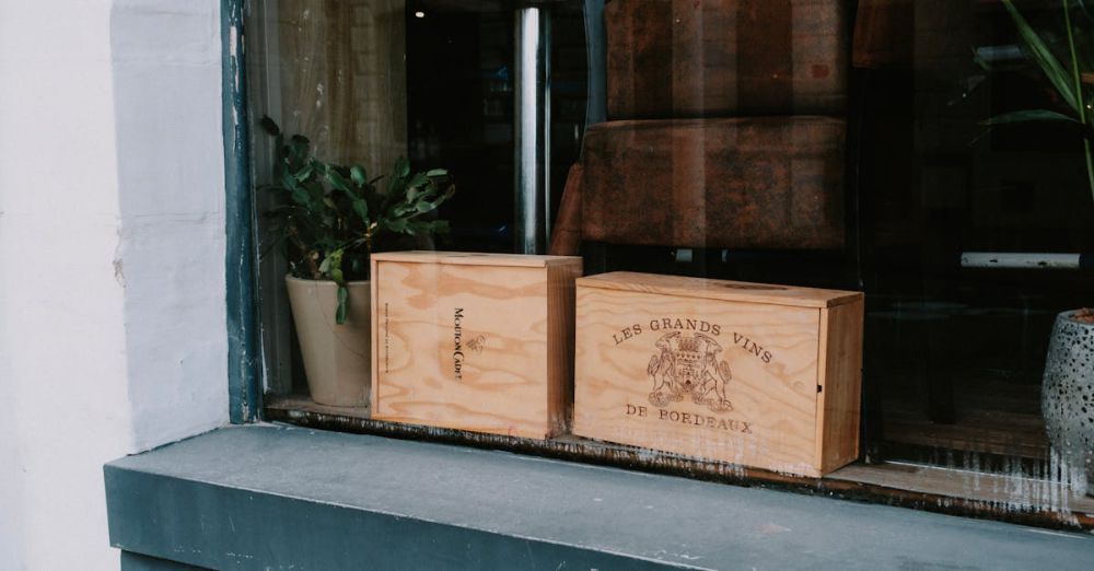 Wine Boxes - Wooden wine crates displayed in a shop window, showcasing rustic charm and vintage appeal.