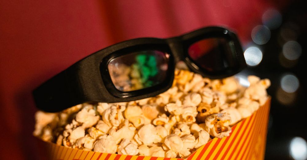 Movie Boxes - Close-up of popcorn and 3D glasses on cinema seats, ready for a movie experience.