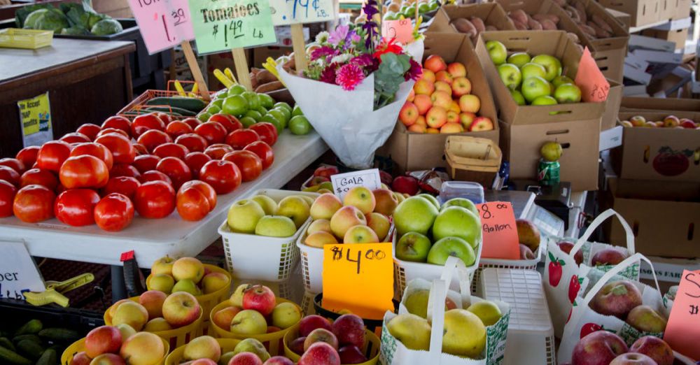 Healthy Boxes - Fresh fruits and vegetables for sale at a North Carolina farmers market stall.