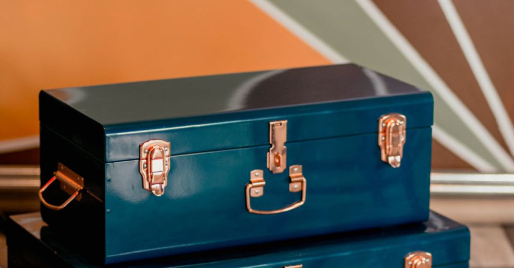 Travel Boxes - Two vintage blue storage chests set on a cozy carpet in modern indoor decor.