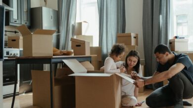 Couples’ Boxes - A family unpacks moving boxes in their new home kitchen, creating a cozy atmosphere.