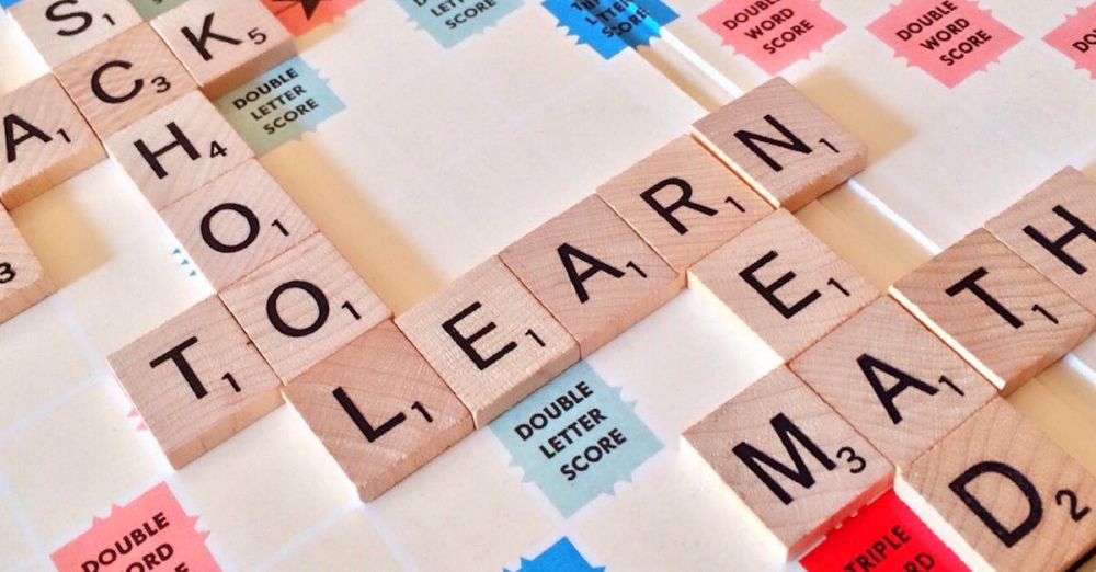 Puzzles - Close-up of Scrabble tiles forming words related to education and school.