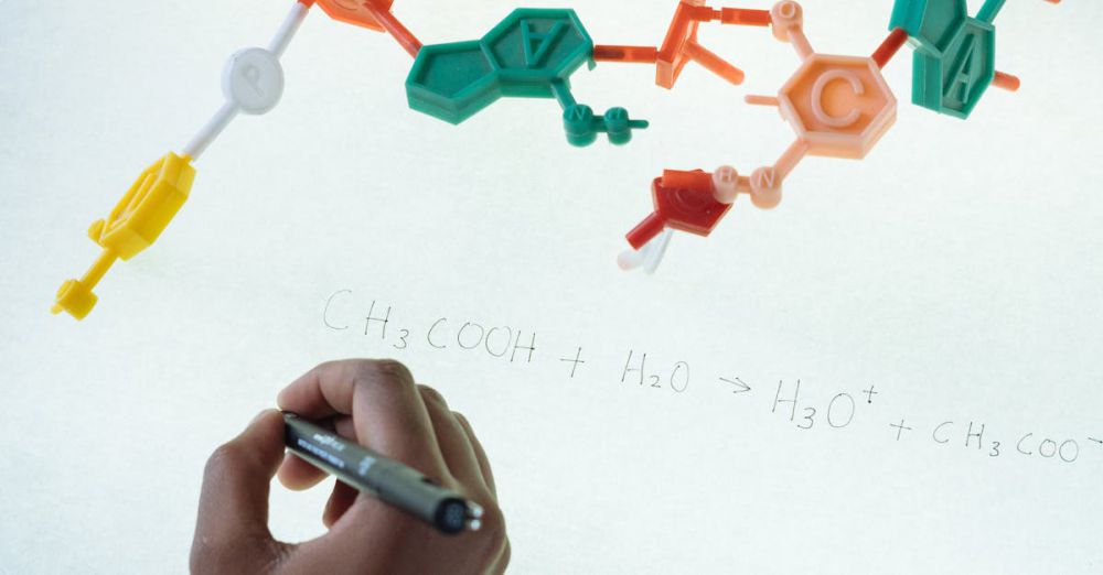 Science Kits - Anonymous chemist writing with marker on illuminated magnetic board formula of Hydronium and Acetate production after studying plastic model of molecule in laboratory