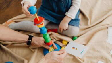 Flashcards - A child playing with colorful educational toys and flashcards indoors.