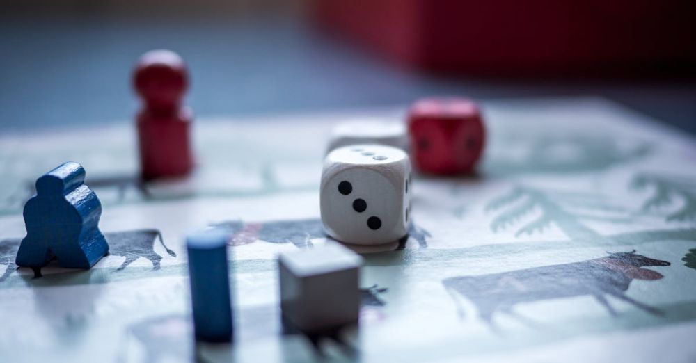 Board Games - Close-up view of board game pieces and dice on a game board. Perfect for recreation and strategy themes.