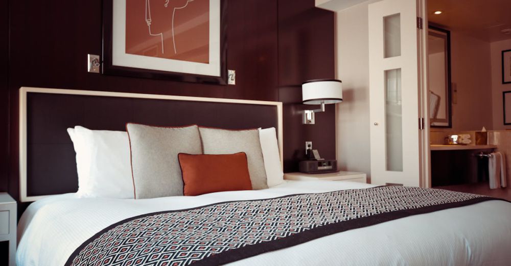 Bedding - Cozy and modern hotel bedroom interior with elegant decor and soft lighting.