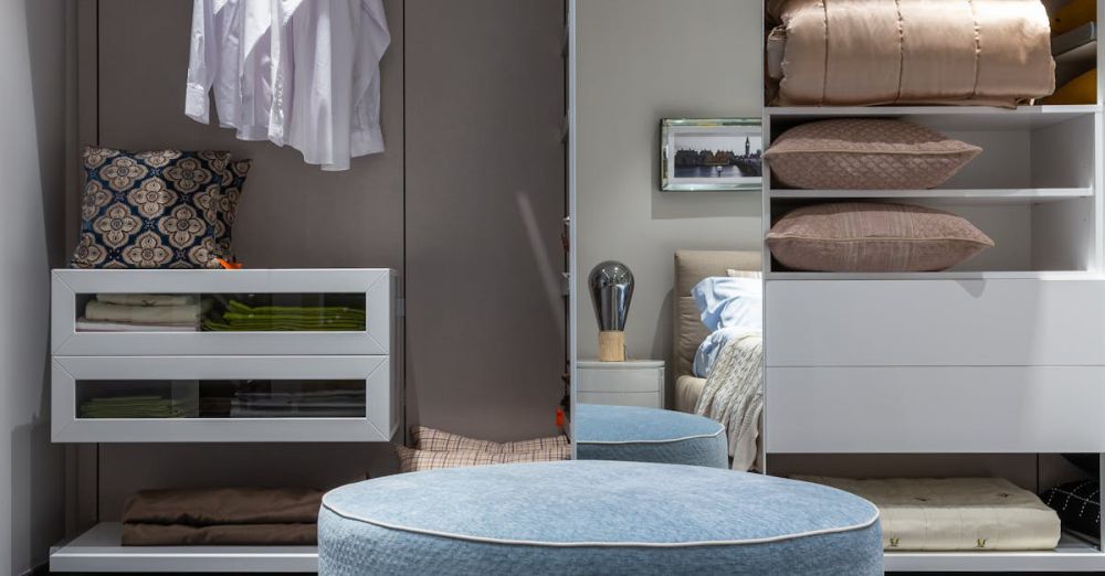 Storage Ottomans - Contemporary bedroom closet featuring neat apparel and soft textiles, perfect for stylish interiors.