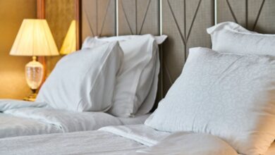 Beds - Inviting hotel room with comfortable bedding and ambient lighting, perfect for relaxation and luxury stay.