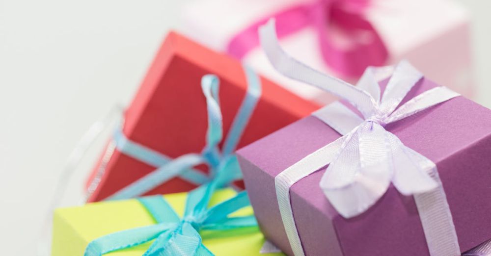 Gifts - Close-up of vibrant gift boxes with ribbons, perfect for festive occasions.