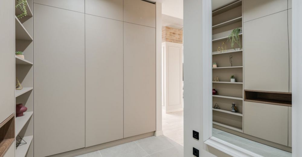 Wardrobes - Explore this sleek and modern corridor featuring minimalist design with built-in wardrobes and stylish shelves.