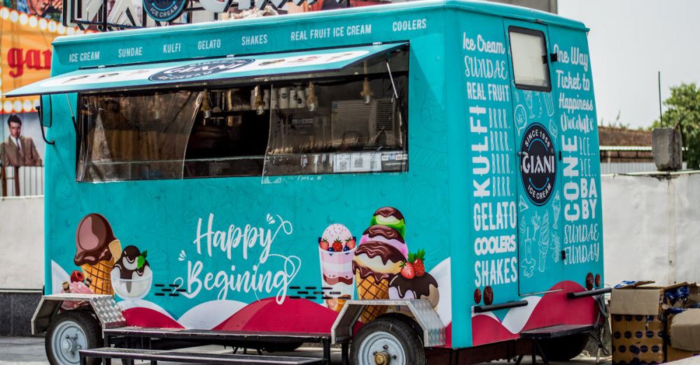 Coolers - Vibrant ice cream truck parked outdoors offering a variety of sweet treats like gelato and sundaes.