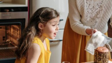 Cooking Tools - A mother and daughter bond while baking a colorful Easter cake in a cozy kitchen setting.