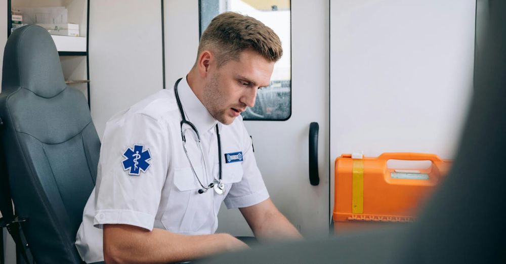 First Aid Kits - Focused paramedic in an ambulance setting, wearing uniform and stethoscope, ready for emergency response.