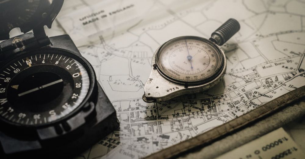 Navigation Tools - A vintage compass and navigation instrument on an old map, showcasing precision tools for exploration.