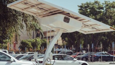 Solar Chargers - Modern solar-powered charging station for electric vehicles on a sunny day.