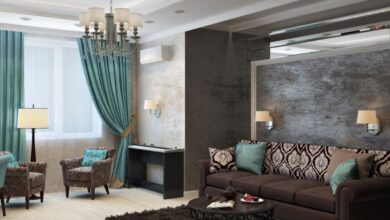 Decorations - Luxurious modern living room with chandelier, sofa, armchairs, and stylish decor.