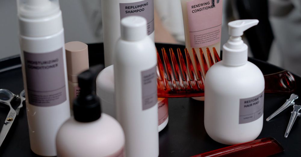 Anti-Redness Creams - Collection of haircare products including shampoo and conditioner on a salon counter.