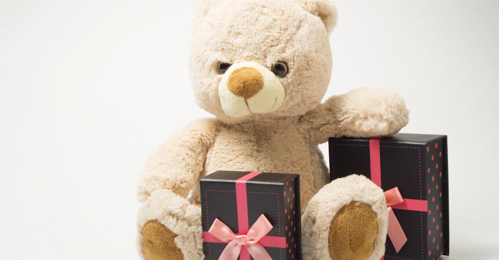 Gifts - Adorable teddy bear with gift boxes tied with pink ribbons, perfect for celebrations.