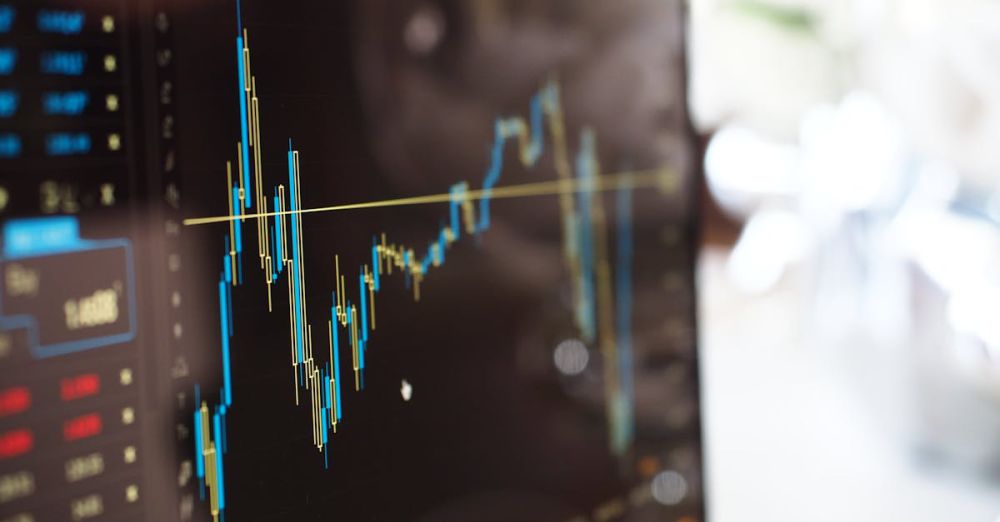 Exchange - Detailed view of financial trading graphs on a monitor, illustrating stock market trends.