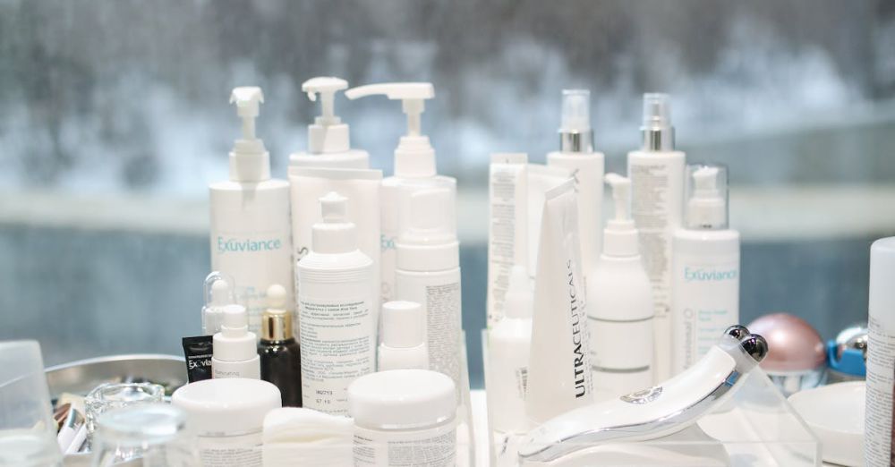 Blowout Creams - Skincare products arranged on a table by a window with a city view in the background.