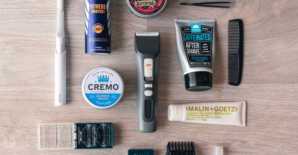 Hair Wax - Flat lay of men's grooming essentials on wooden surface, including razor, cream, and comb.