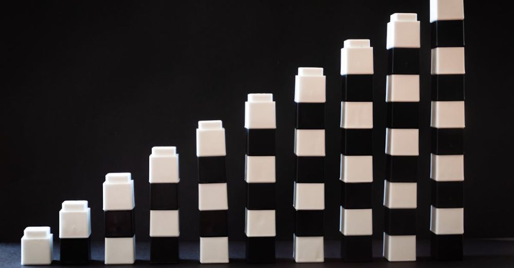 Cubes - Black and white toy blocks arranged in ascending order to symbolize growth or progress.