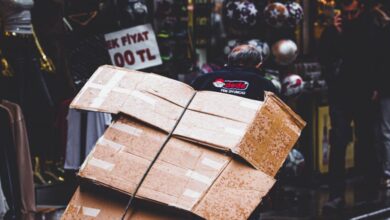 Subscription Boxes - A street vendor hauls boxes through a lively market street in İstanbul, Türkiye.