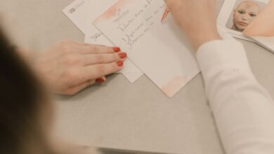 Skincare Products - Woman writing notes during a beauty consultation indoors.