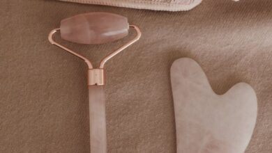 Spa Kits - Flat lay of a rose quartz skincare tool set and towels for a wellness routine.