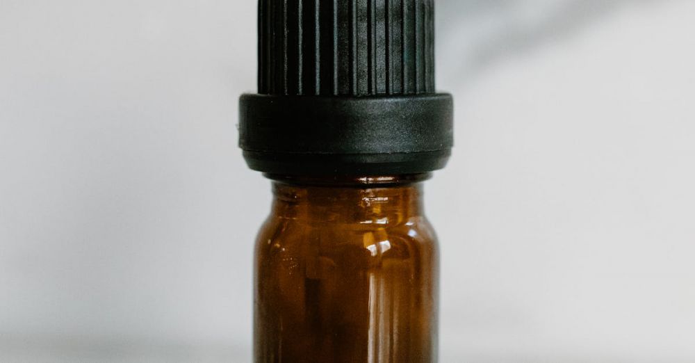 Retreat Packages - Close-up of a brown essential oil bottle with black cap, ideal for aromatherapy and wellness content.