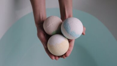 Bath Bombs - A soothing image of three bath bombs held over a tranquil bath, ideal for relaxation themes.