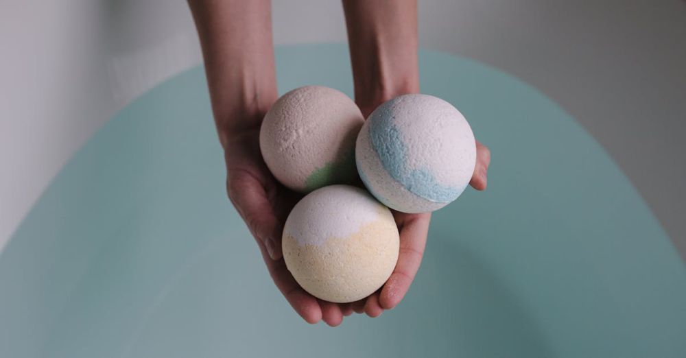 Bath Bombs - A soothing image of three bath bombs held over a tranquil bath, ideal for relaxation themes.