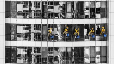 Cleaners - High-rise window cleaners in Dubai cleaning a skyscraper, showcasing urban architecture.