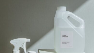 Detergents - Elegant arrangement of cleaning products with natural sunlight casting shadows, highlighting a minimalist aesthetic.