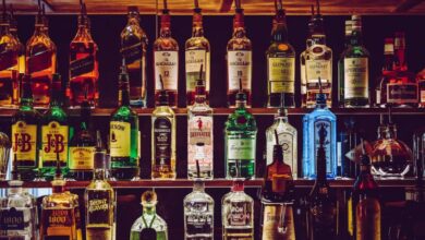 Bottles - An array of various liquor bottles beautifully displayed on a bar shelf.