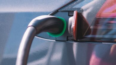 Chargers - Close-up of an electric car plugged into a charging station, showcasing modern technology.