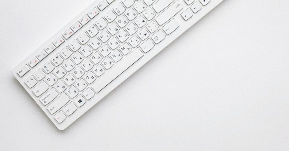 Keyboard - A modern white keyboard on a white background showcasing minimalist design and clean aesthetics.