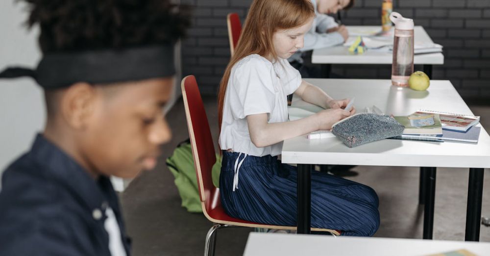 Pencil Cases - Diverse classroom scene with attentive children working at desks, fostering education.