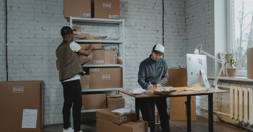 Desk Products - Two workers handling packages and organizing stock in a warehouse setting.