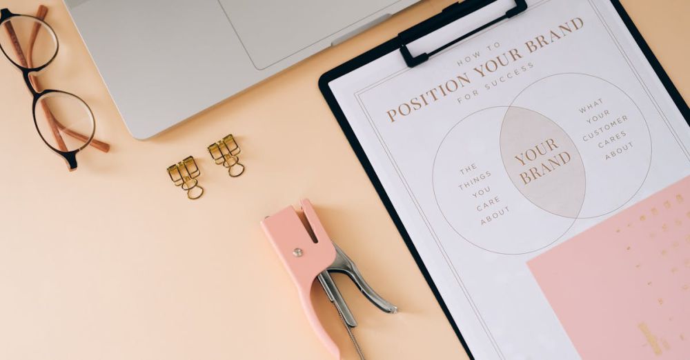 Staplers - A flat lay composition featuring office essentials and a branding strategy clipboard on a modern workspace.